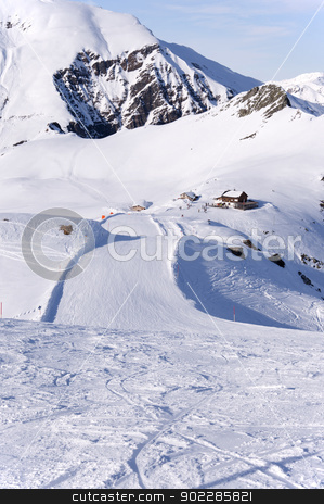 To use this stock image in your creative project, please select the size you need over to the right and click the "Add to Cart" button.
Your downloaded image will come with the Cutcaster watermark removed so don’t worry about the watermark you see on this page. Ski run and hut in Alps stock photo, Zillertal Alps in Austria, ski piste and hut viewed from the summit of Tuxkogel mountain at sunset light by Krzysztof Nahlik