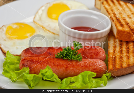 To use this stock image in your creative project, please select the size you need over to the right and click the "Add to Cart" button.
Your downloaded image will come with the Cutcaster watermark removed so don’t worry about the watermark you see on this page. Fried eggs with sausages stock photo, Fried eggs with sausages, toasts, greens and sauce by olinchuk