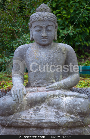Stone Buddha in the lotus position. Stone Buddha in the lotus position. stock photo, Sitting stone statue of the god Buddha sitting in lotus position. by Borys Shevchuk