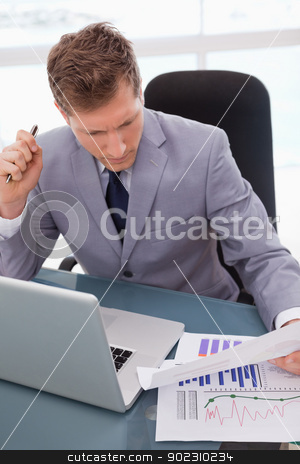 To use this stock image in your creative project, please select the size you need over to the right and click the "Add to Cart" button.
Your downloaded image will come with the Cutcaster watermark removed so don’t worry about the watermark you see on this page. Businessman sitting at his desk stock photo, Businessman with statistics sitting at his desk by Wavebreak Media