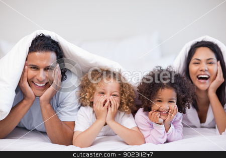 To use this stock image in your creative project, please select the size you need over to the right and click the "Add to Cart" button.
Your downloaded image will come with the Cutcaster watermark removed so don’t worry about the watermark you see on this page. Joyful family hiding under the blanket stock photo, Joyful young family hiding under the blanket by Wavebreak Media