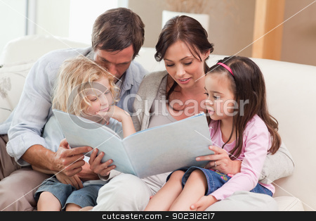 To use this stock image in your creative project, please select the size you need over to the right and click the "Add to Cart" button.
Your downloaded image will come with the Cutcaster watermark removed so don’t worry about the watermark you see on this page. Family looking at a photo album stock photo, Family looking at a photo album in the living room by Wavebreak Media