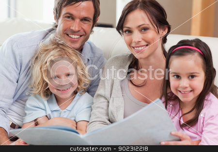 To use this stock image in your creative project, please select the size you need over to the right and click the "Add to Cart" button.
Your downloaded image will come with the Cutcaster watermark removed so don’t worry about the watermark you see on this page. Close up of a family looking at a photo album stock photo, Close up of a family looking at a photo album in a living room by Wavebreak Media