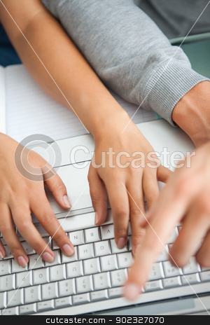 To use this stock image in your creative project, please select the size you need over to the right and click the "Add to Cart" button.
Your downloaded image will come with the Cutcaster watermark removed so don’t worry about the watermark you see on this page. High view of students hands working with a laptop stock photo, High view of students hands working with a laptop while typing and pointing the screen by Wavebreak Media