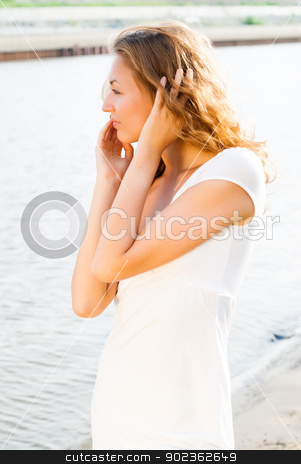 To use this stock image in your creative project, please select the size you need over to the right and click the "Add to Cart" button.
Your downloaded image will come with the Cutcaster watermark removed so don’t worry about the watermark you see on this page. a young brunette caucasian girl at river stock photo, a young brunette european girl walking on river bank by Aikon