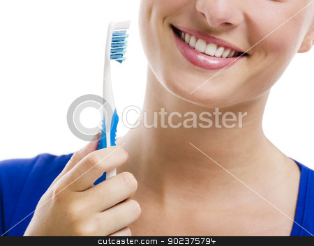 Beautiful woman with a toothbrush Beautiful woman with a toothbrush stock photo, Beautiful woman with a great smile holding toothbrush, isolated over a white background by ikostudio