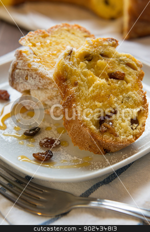 To use this stock image in your creative project, please select the size you need over to the right and click the "Add to Cart" button.
Your downloaded image will come with the Cutcaster watermark removed so don’t worry about the watermark you see on this page. Sweet raisin bread stock photo, Sweet bread with raisin and honey in a dish by Giordano Aita