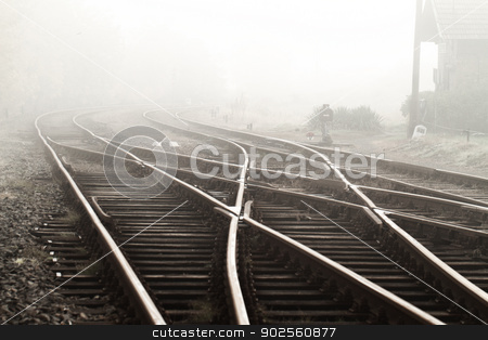To use this stock image in your creative project, please select the size you need over to the right and click the "Add to Cart" button.
Your downloaded image will come with the Cutcaster watermark removed so don’t worry about the watermark you see on this page. Railway in fog stock photo, Railway in fog on station, outdoor landscape by Nneirda