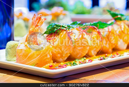 To use this stock image in your creative project, please select the size you need over to the right and click the "Add to Cart" button.
Your downloaded image will come with the Cutcaster watermark removed so don’t worry about the watermark you see on this page. salmon Roll with Shrimp stock photo, Spicy Sushi salmon Roll with Shrimps, Japanese Cuisine (selective focus at front) by Vichaya Kiatying-Angsulee