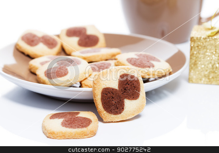 To use this stock image in your creative project, please select the size you need over to the right and click the "Add to Cart" button.
Your downloaded image will come with the Cutcaster watermark removed so don’t worry about the watermark you see on this page. christmas cookies with a plate stock photo, christmas cookies with a brown small plate in front of a small golden christmas present and a coffee cup by Rob Stark