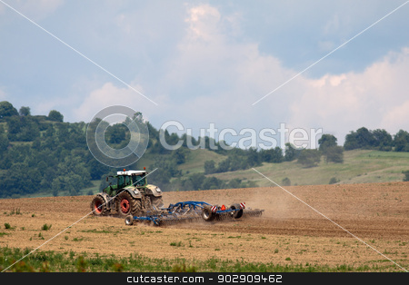 To use this stock image in your creative project, please select the size you need over to the right and click the "Add to Cart" button.
Your downloaded image will come with the Cutcaster watermark removed so don’t worry about the watermark you see on this page. Tractor working on the field stock photo, Tractor plowing field with harrow, in the background sky and trees by Marian Bauer