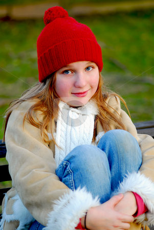 To use this stock image in your creative project, please select the size you need over to the right and click the "Add to Cart" button.
Your downloaded image will come with the Cutcaster watermark removed so don’t worry about the watermark you see on this page. Girl on bench stock photo, Portrait of a young girl sitting on a bench outside by Elena Elisseeva