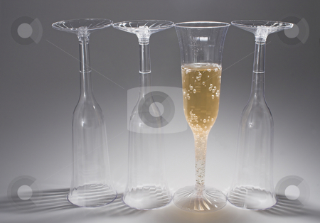 To use this stock image in your creative project, please select the size you need over to the right and click the "Add to Cart" button.
Your downloaded image will come with the Cutcaster watermark removed so don’t worry about the watermark you see on this page. Champagne stock photo, Bubbling champagne in a crystal champagne flute. by Robert Byron