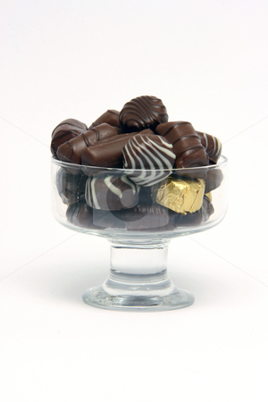 Chocolates Chocolates stock photo, Chocolates in crystal bowl on white background food concepts by EVANGELOS THOMAIDIS