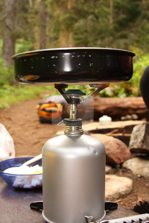 To use this stock image in your creative project, please select the size you need over to the right and click the "Add to Cart" button.
Your downloaded image will come with the Cutcaster watermark removed so don’t worry about the watermark you see on this page. Camp Kitchen stock photo, Camp stove with flame and a frying pan. by Steve Stedman
