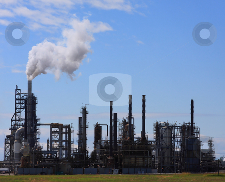 To use this stock image in your creative project, please select the size you need over to the right and click the "Add to Cart" button.
Your downloaded image will come with the Cutcaster watermark removed so don’t worry about the watermark you see on this page. Oil Refinery View stock photo, Oil refinery billowing smoke into blue sky by Steve Stedman