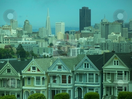 Famous View Of San Francisco Famous View Of San Francisco stock photo, This is possibly the most famous view of San Francisco, byond the row of historic houses lies the heart of San Francisco . This is a high resolution photo (8 megapixels) and has alot of potential. by Andy C