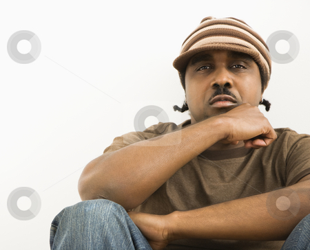 To use this stock image in your creative project, please select the size you need over to the right and click the "Add to Cart" button.
Your downloaded image will come with the Cutcaster watermark removed so don’t worry about the watermark you see on this page. Man wearing knit cap. stock photo, African-American mid-adult man wearing hat looking at viewer. by Iofoto Images