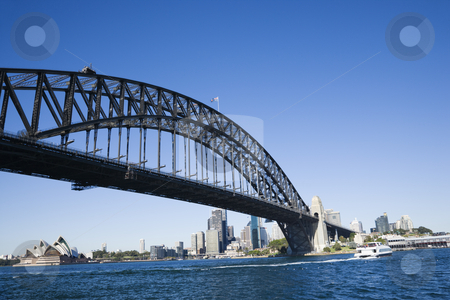 To use this stock image in your creative project, please select the size you need over to the right and click the "Add to Cart" button.
Your downloaded image will come with the Cutcaster watermark removed so don’t worry about the watermark you see on this page. Sydney Harbour Bridge. stock photo, Sydney Harbour Bridge with view of downtown buildings and Sydney Opera House in Australia. by Iofoto Images