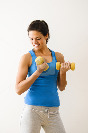 To use this stock image in your creative project, please select the size you need over to the right and click the "Add to Cart" button.
Your downloaded image will come with the Cutcaster watermark removed so don’t worry about the watermark you see on this page. Woman lifting weights stock photo, Woman lifting hand weights and smiling. by Iofoto Images