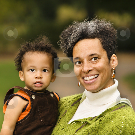 To use this stock image in your creative project, please select the size you need over to the right and click the "Add to Cart" button.
Your downloaded image will come with the Cutcaster watermark removed so don’t worry about the watermark you see on this page. Woman and boy portrait stock photo, Head and shoulder portrait of woman holding boy and smiling. by Iofoto Images