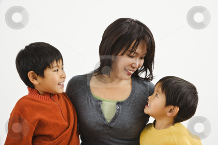 To use this stock image in your creative project, please select the size you need over to the right and click the "Add to Cart" button.
Your downloaded image will come with the Cutcaster watermark removed so don’t worry about the watermark you see on this page. Asian family stock photo, Asian mother and two sons smiling at eachother. by Iofoto Images