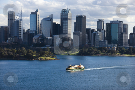 To use this stock image in your creative project, please select the size you need over to the right and click the "Add to Cart" button.
Your downloaded image will come with the Cutcaster watermark removed so don’t worry about the watermark you see on this page. Sydney, Australia skyline. stock photo, Aerial view ferryboat crossing harbour with skyline of Sydney, Australia. by Iofoto Images