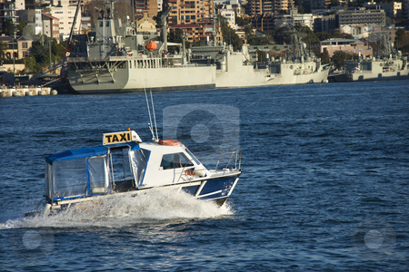 To use this stock image in your creative project, please select the size you need over to the right and click the "Add to Cart" button.
Your downloaded image will come with the Cutcaster watermark removed so don’t worry about the watermark you see on this page. Water taxi, Australia. stock photo, Water taxi and view of buildings and boats in Sydney, Australia. by Iofoto Images