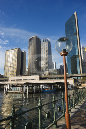 To use this stock image in your creative project, please select the size you need over to the right and click the "Add to Cart" button.
Your downloaded image will come with the Cutcaster watermark removed so don’t worry about the watermark you see on this page. Railway station, Sydney. stock photo, Circular Quay Railway Station in Sydney Cove with view of downtown skyscrapers and lammpost in Sydney, Australia. by Iofoto Images