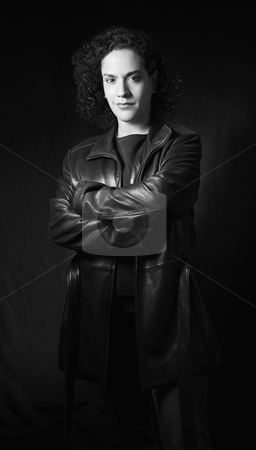Serious woman portrait. Serious woman portrait. stock photo, Woman in leather jacket with arms crossed looking at viewer. by Iofoto Images