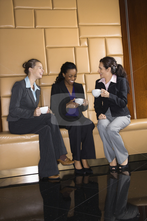 Businesswomen with coffee. Businesswomen with coffee. stock photo, Businesswomen drinking coffee and conversing. by Iofoto Images
