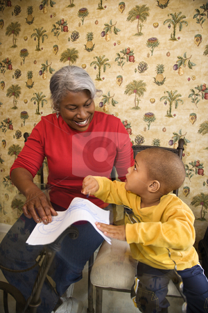 To use this stock image in your creative project, please select the size you need over to the right and click the "Add to Cart" button.
Your downloaded image will come with the Cutcaster watermark removed so don’t worry about the watermark you see on this page. Grandmother and grandson coloring. stock photo, Portrait of African American grandmother with grandson coloring. by Iofoto Images