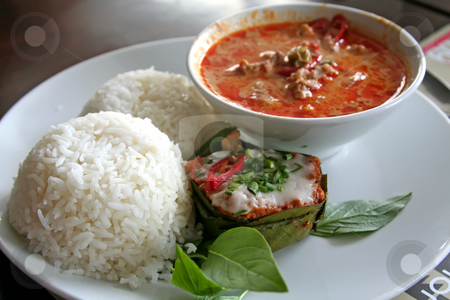 To use this stock image in your creative project, please select the size you need over to the right and click the "Add to Cart" button.
Your downloaded image will come with the Cutcaster watermark removed so don’t worry about the watermark you see on this page. Thai curry stock photo, Thai dish of spicy curry steamed fish pudding and rice traditional cuisine by Kheng Guan Toh