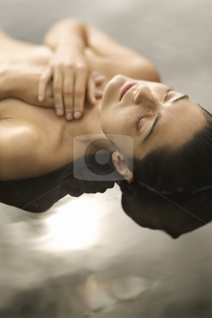 To use this stock image in your creative project, please select the size you need over to the right and click the "Add to Cart" button.
Your downloaded image will come with the Cutcaster watermark removed so don’t worry about the watermark you see on this page. Woman in water. stock photo, Close up of young nude Caucasian woman lying on back in water with eyes closed and hands crossed on chest. by Iofoto Images
