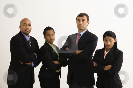 Serious business portrait. Serious business portrait. stock photo, Portrait of businessmen and businesswomen standing with arms crossed looking serious. by Iofoto Images