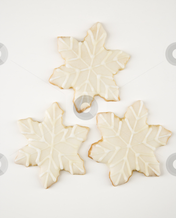 To use this stock image in your creative project, please select the size you need over to the right and click the "Add to Cart" button.
Your downloaded image will come with the Cutcaster watermark removed so don’t worry about the watermark you see on this page. Snowflake cookies. stock photo, Three snowflake sugar cookies with decorative icing. by Iofoto Images