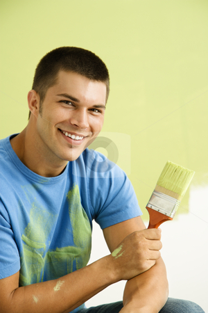 To use this stock image in your creative project, please select the size you need over to the right and click the "Add to Cart" button.
Your downloaded image will come with the Cutcaster watermark removed so don’t worry about the watermark you see on this page. Man painting wall. stock photo, Smiling man kneeling in front of partially painted wall holding paintbrush. by Iofoto Images
