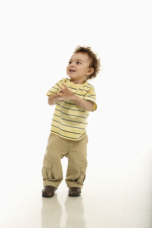 Happy toddler boy. Happy toddler boy. stock photo, African American toddler boy standing with hands together and happy expression. by Iofoto Images