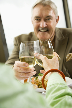 To use this stock image in your creative project, please select the size you need over to the right and click the "Add to Cart" button.
Your downloaded image will come with the Cutcaster watermark removed so don’t worry about the watermark you see on this page. Mature couple toasting. stock photo, Mature couple dining and toasting in fancy restaurant. by Iofoto Images