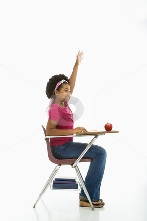 To use this stock image in your creative project, please select the size you need over to the right and click the "Add to Cart" button.
Your downloaded image will come with the Cutcaster watermark removed so don’t worry about the watermark you see on this page. Eager schoolgirl. stock photo, Side view of African American girl sitting in school desk raising hand. by Iofoto Images