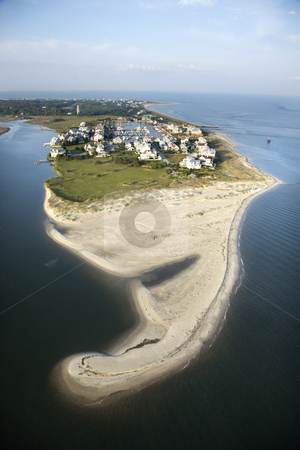 To use this stock image in your creative project, please select the size you need over to the right and click the "Add to Cart" button.
Your downloaded image will come with the Cutcaster watermark removed so don’t worry about the watermark you see on this page. Beach community. stock photo, Aerial view of beach and residential community on Bald Head Island, North Carolina. by Iofoto Images