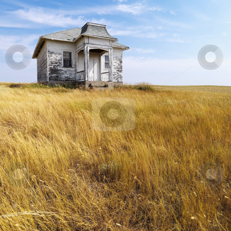 Old abandoned house. Old abandoned house. stock photo, Weathered abandoned building in remote grassland. by Iofoto Images