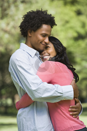 To use this stock image in your creative project, please select the size you need over to the right and click the "Add to Cart" button.
Your downloaded image will come with the Cutcaster watermark removed so don’t worry about the watermark you see on this page. Couple embracing. stock photo, Attractive couple smiling and embracing in park. by Iofoto Images