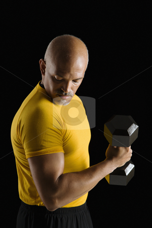 To use this stock image in your creative project, please select the size you need over to the right and click the "Add to Cart" button.
Your downloaded image will come with the Cutcaster watermark removed so don’t worry about the watermark you see on this page. Man exercising with dumbbell. stock photo, Mid adult multiethnic man wearing yellow exercise shirt doing arm curls while looking at bicep. by Iofoto Images