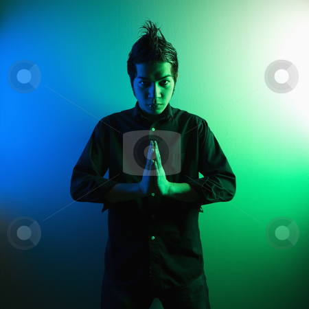 To use this stock image in your creative project, please select the size you need over to the right and click the "Add to Cart" button.
Your downloaded image will come with the Cutcaster watermark removed so don’t worry about the watermark you see on this page. Young attractive hip man. stock photo, Portrait of attractive young Asian Filipino man standing holding hands in prayer position. by Iofoto Images