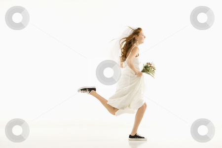 To use this stock image in your creative project, please select the size you need over to the right and click the "Add to Cart" button.
Your downloaded image will come with the Cutcaster watermark removed so don’t worry about the watermark you see on this page. Running bride. stock photo, Caucasian bride running and holding bouquet. by Iofoto Images