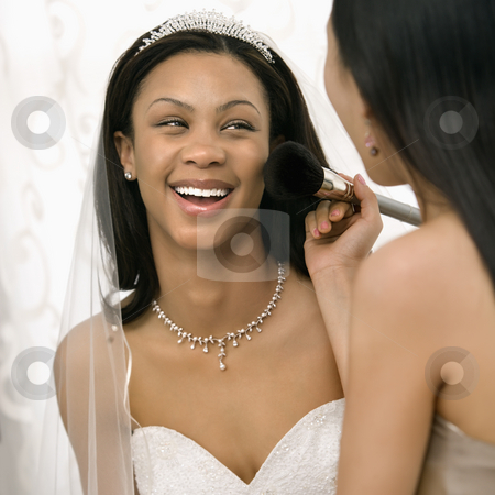 To use this stock image in your creative project, please select the size you need over to the right and click the "Add to Cart" button.
Your downloaded image will come with the Cutcaster watermark removed so don’t worry about the watermark you see on this page. Bridesmaid applying makeup to bride. stock photo, Asian bridesmaid applying makeup to African-American bride. by Iofoto Images