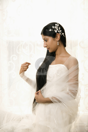 To use this stock image in your creative project, please select the size you need over to the right and click the "Add to Cart" button.
Your downloaded image will come with the Cutcaster watermark removed so don’t worry about the watermark you see on this page. Bridal portrait. stock photo, Portrait of an Indian bride. by Iofoto Images