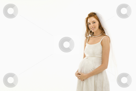 To use this stock image in your creative project, please select the size you need over to the right and click the "Add to Cart" button.
Your downloaded image will come with the Cutcaster watermark removed so don’t worry about the watermark you see on this page. Pregnant bride. stock photo, Pregnant Caucasian bride with hands on her belly. by Iofoto Images
