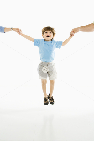 To use this stock image in your creative project, please select the size you need over to the right and click the "Add to Cart" button.
Your downloaded image will come with the Cutcaster watermark removed so don’t worry about the watermark you see on this page. Boy jumping. stock photo, Boy jumping into air holding hands with parents against white background. by Iofoto Images